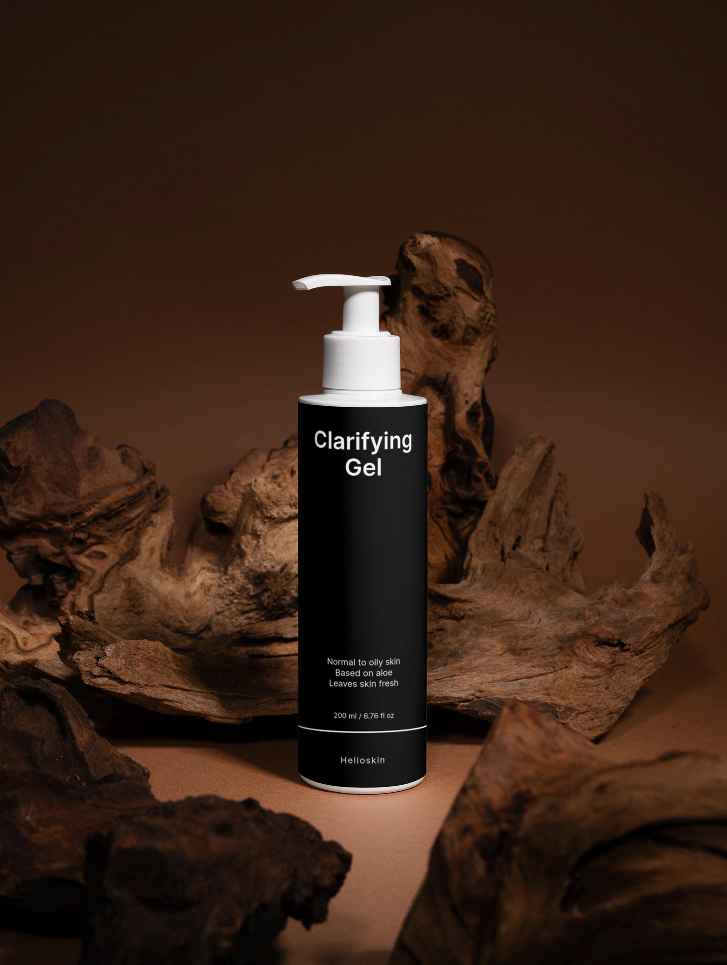 Clarifying Gel bottle with a pump dispenser on a brown background