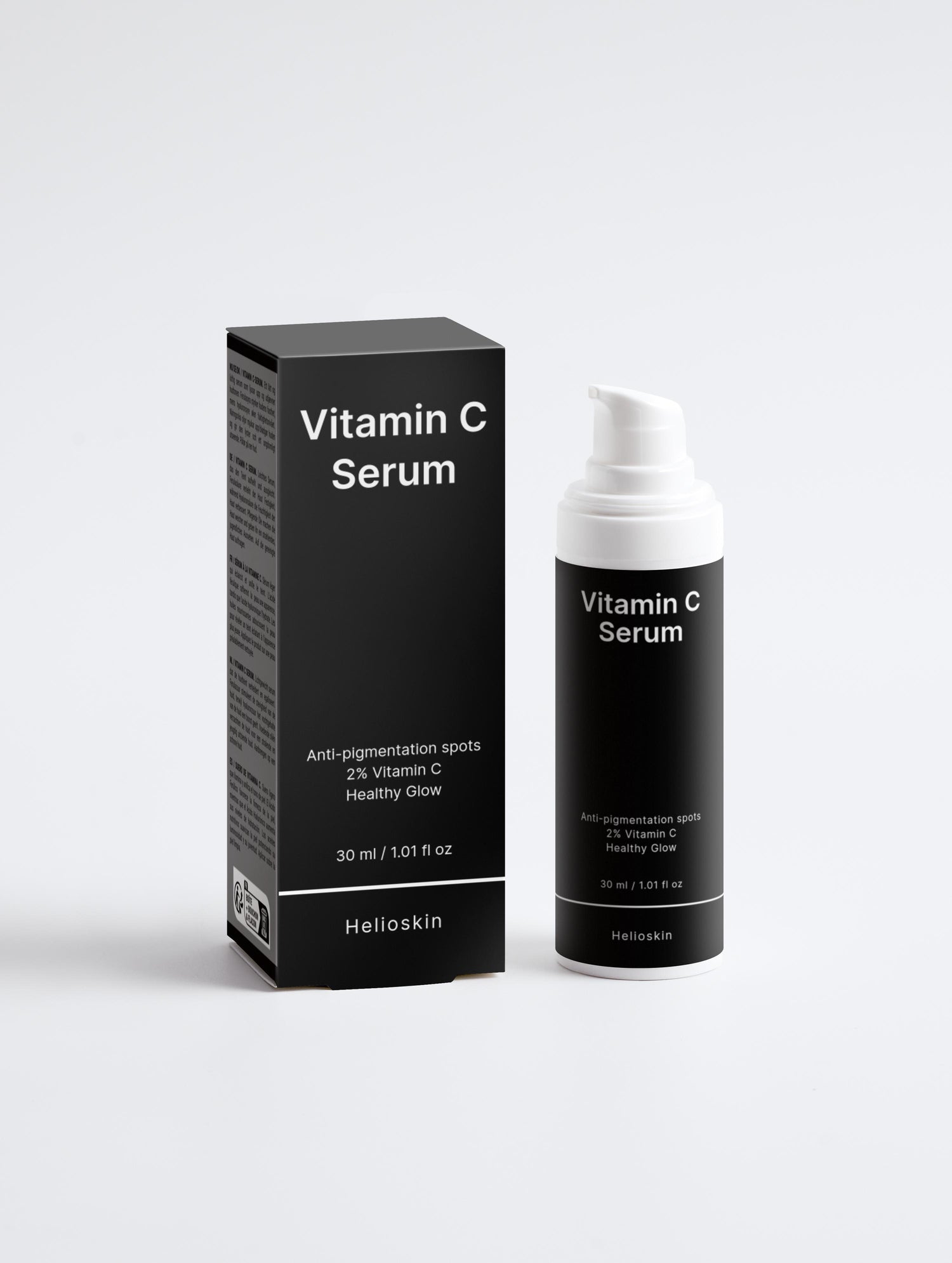 Vitamin C serum packaging with black box and bottle on a white background