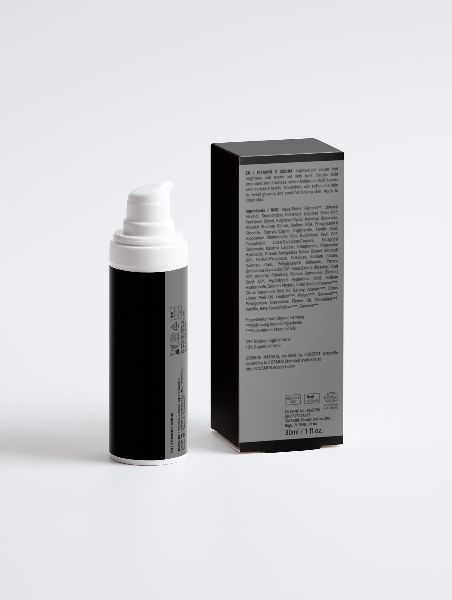 Black and white cosmetic bottle with packaging on a light gray background