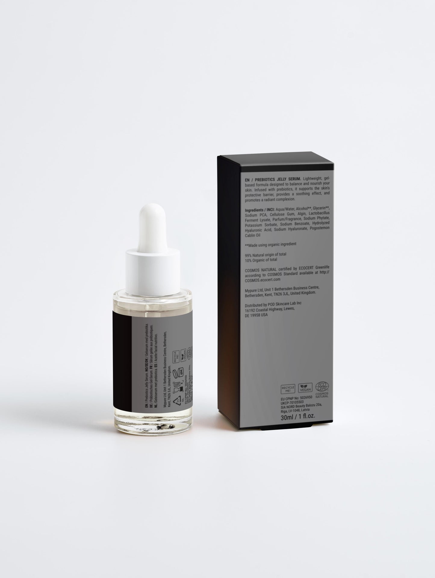 Skincare serum bottle with dropper and packaging on a light gray background