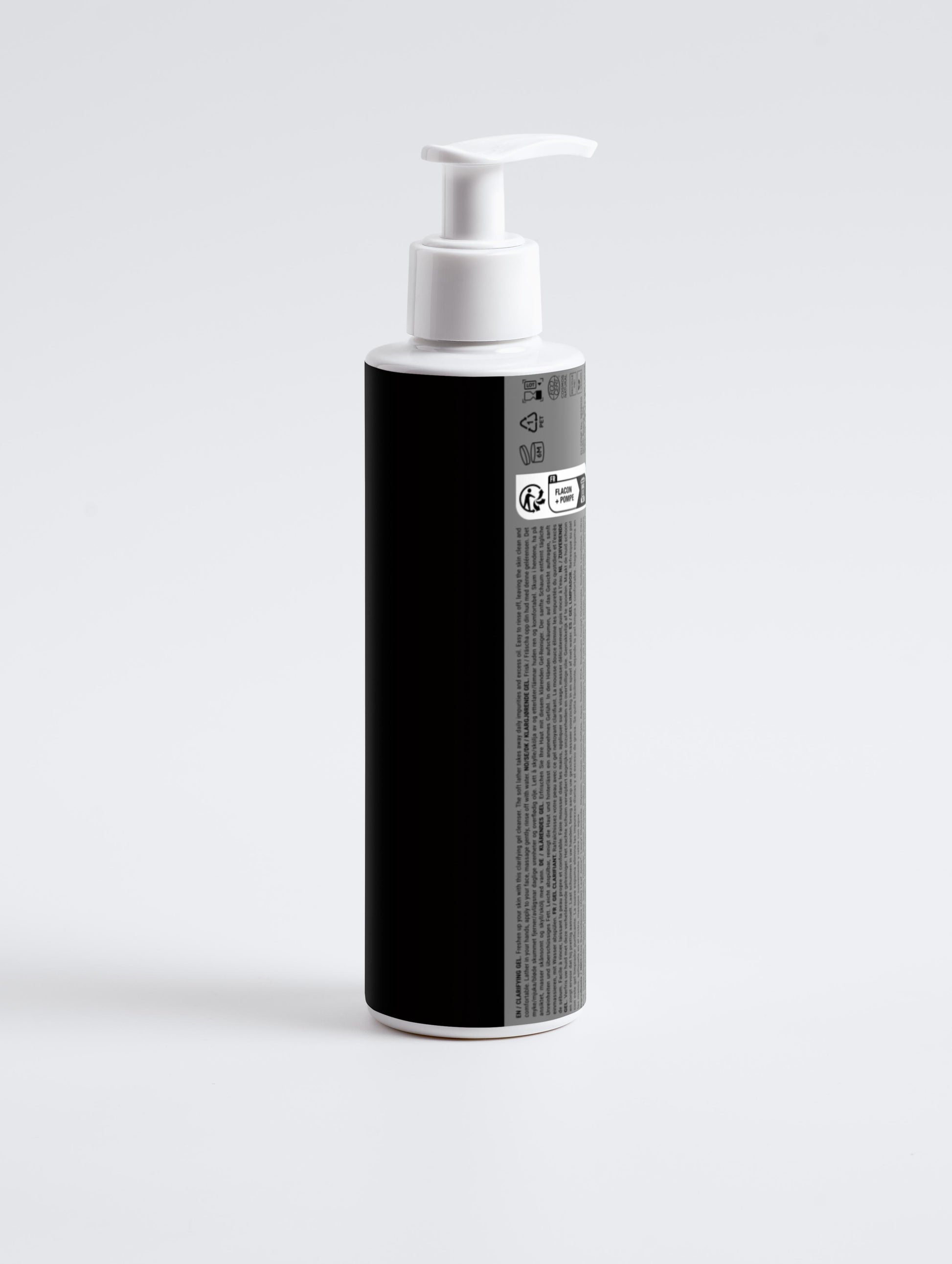 Black bottle with white pump on a light gray background