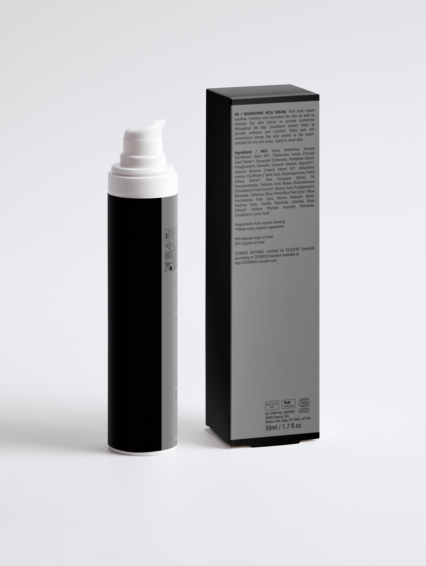 Black and white spray bottle with packaging on a light gray background