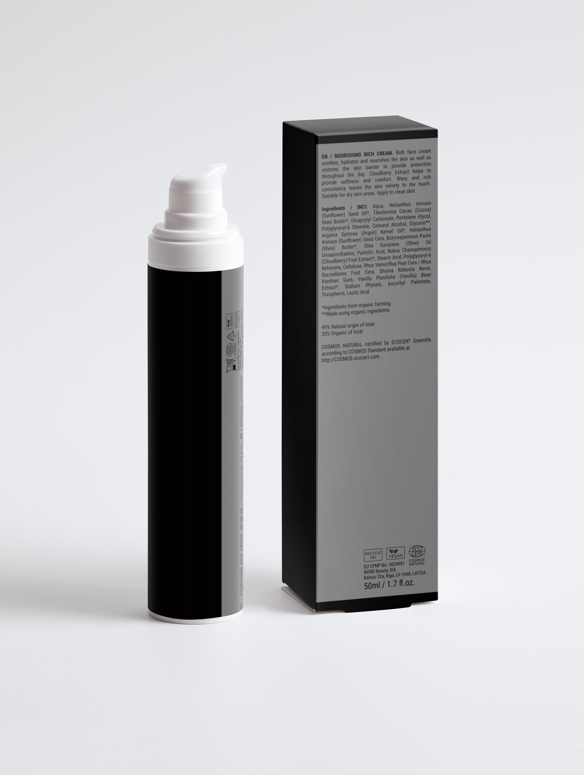 Black and white spray bottle with packaging on a light gray background