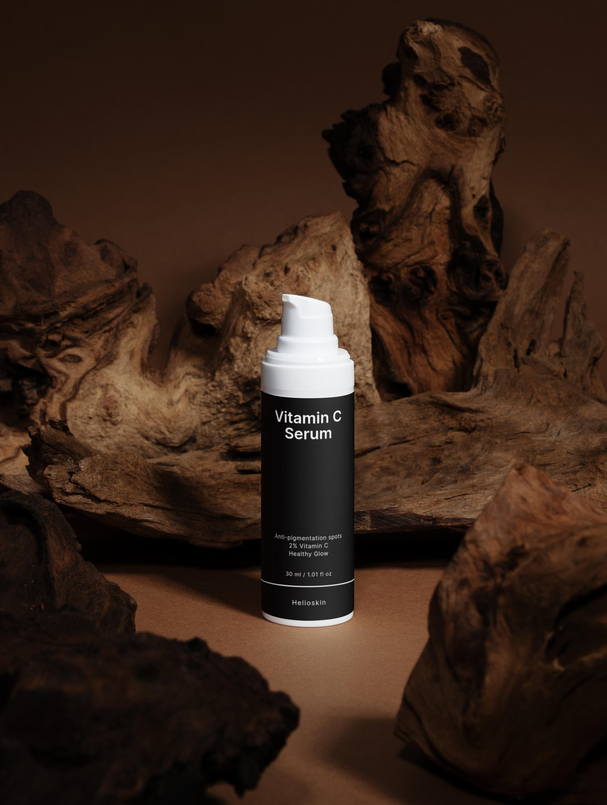 Vitamin C Serum bottle on a textured brown surface