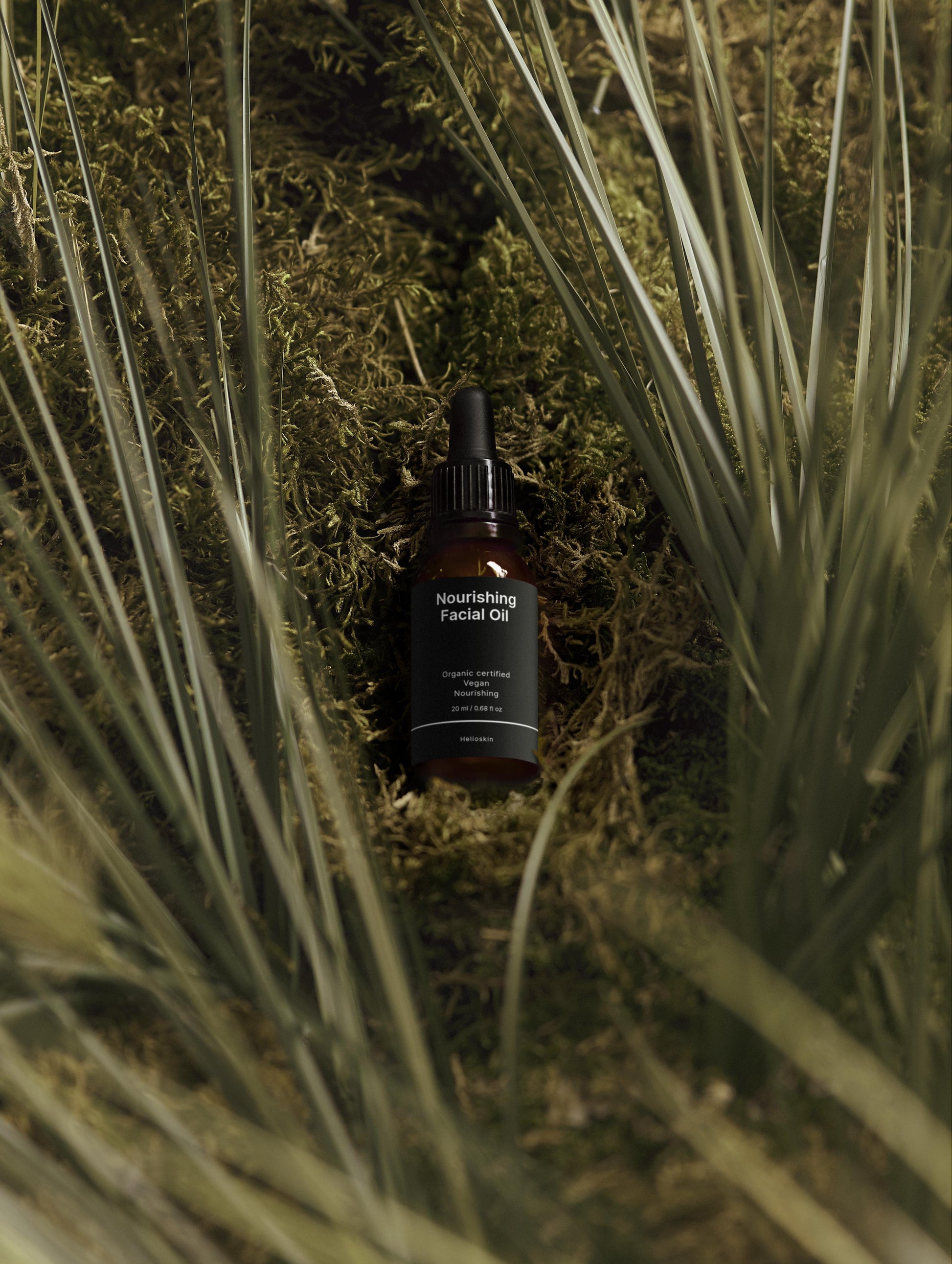 Facial oil bottle labeled 'Nourishing Facial Oil' on a grassy background