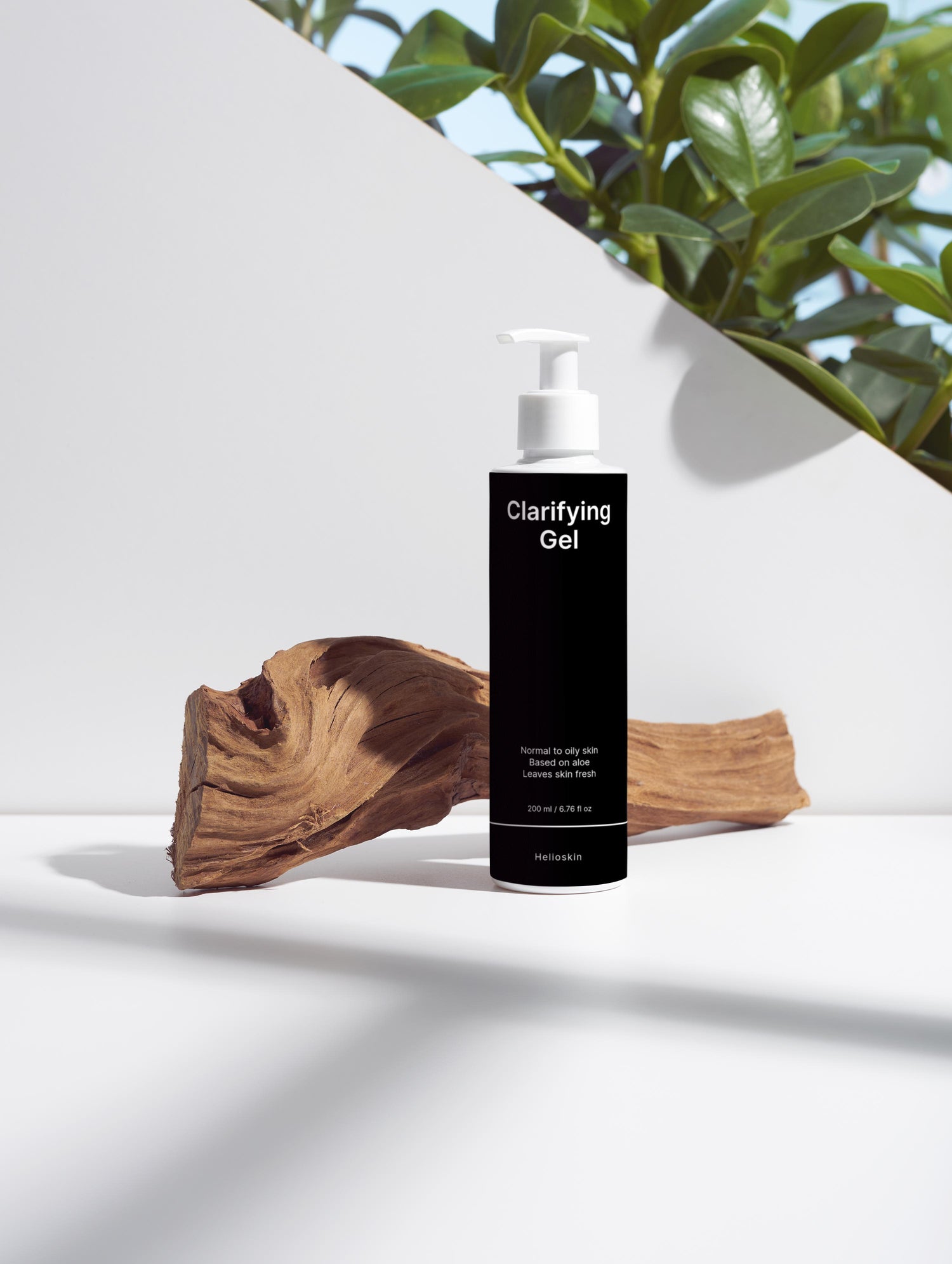 Bottle of Clarifying Gel on a white surface with a natural background
