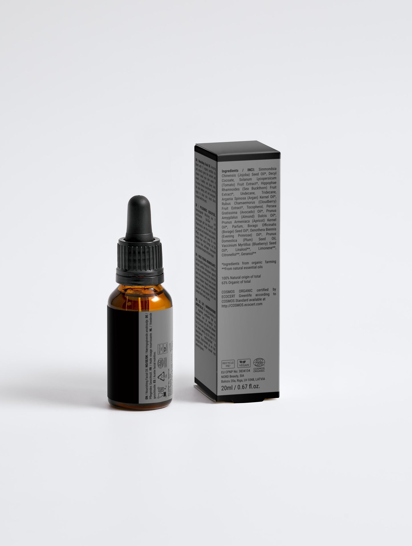 Bottle and box of a skincare product on a white background
