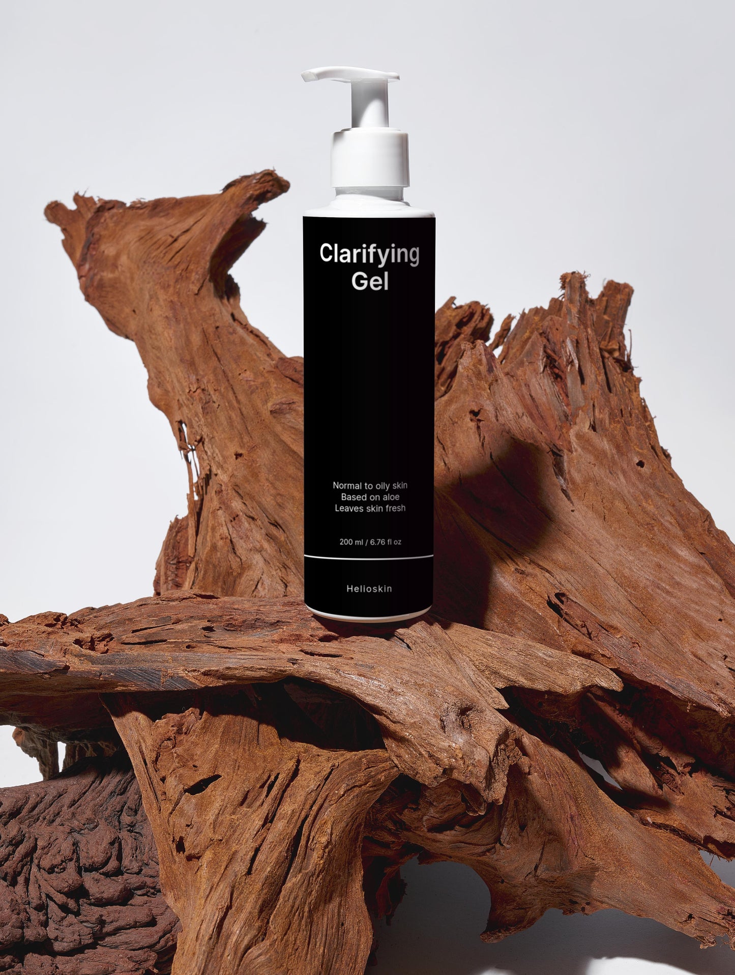 Clarifying Gel bottle on a wooden surface with a white background