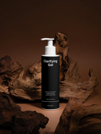Clarifying Gel bottle with a pump dispenser on a brown background