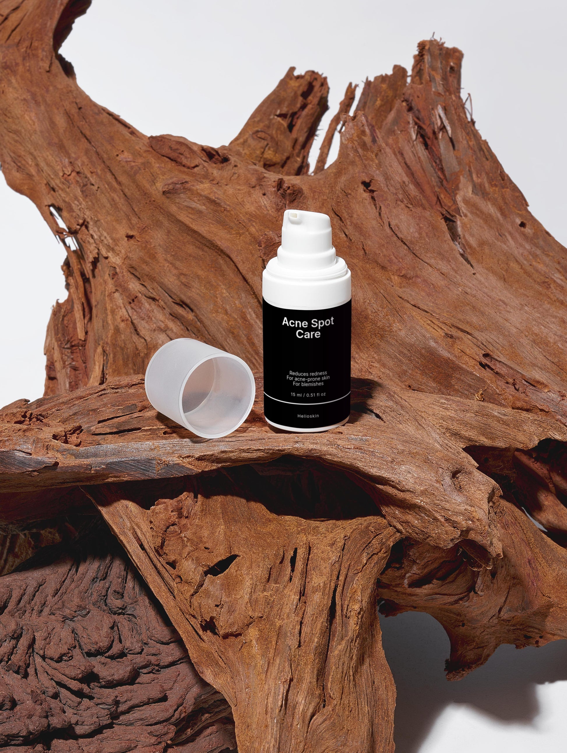 Acne spot care product on a wooden surface