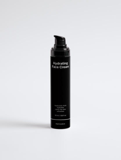 Black bottle of hydrating face cream on a light gray background