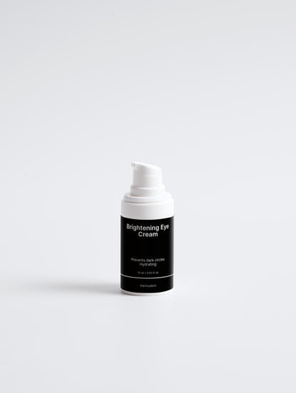 Skincare cream bottle labeled 'Brightening Eye Cream' on a white background