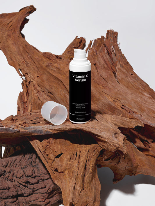 Vitamin C Serum bottle on a wooden surface