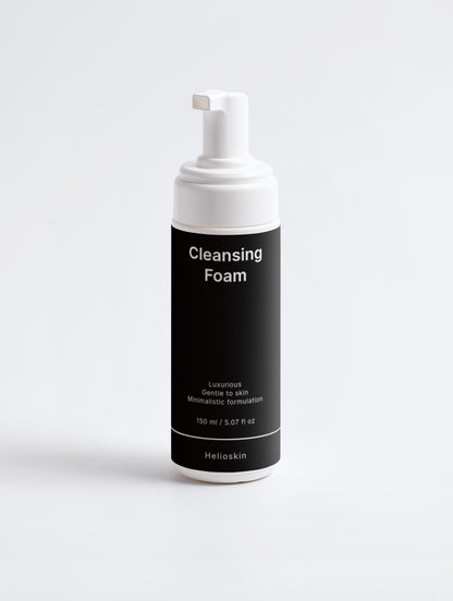 Cleansing foam bottle with black label on a white background