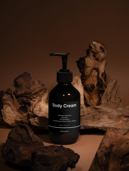 Black body cream bottle with pump on a wooden surface