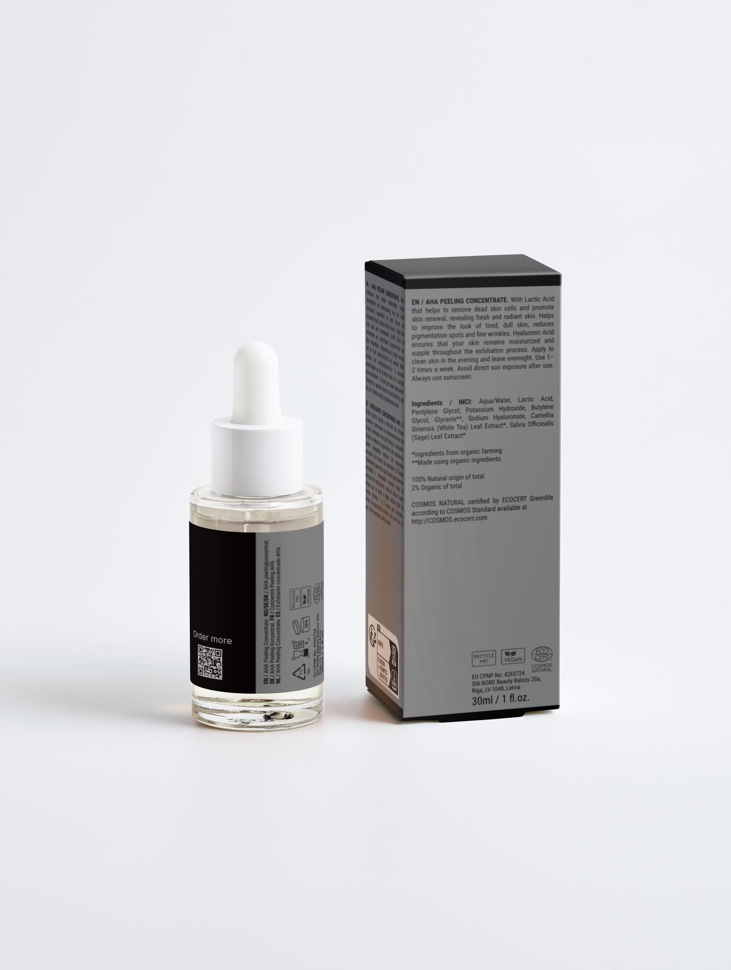 Skincare serum bottle with dropper and packaging on a white background