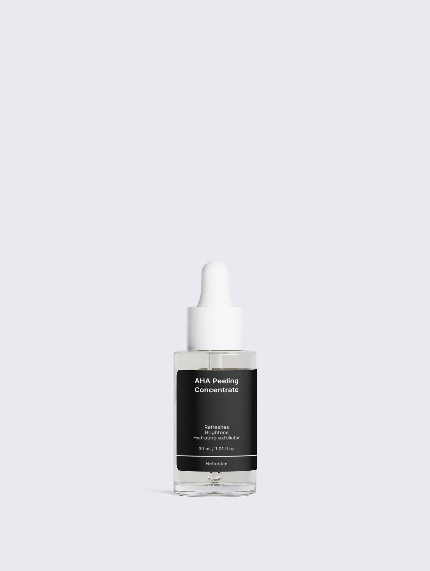 Skincare serum bottle with black label on a light gray background