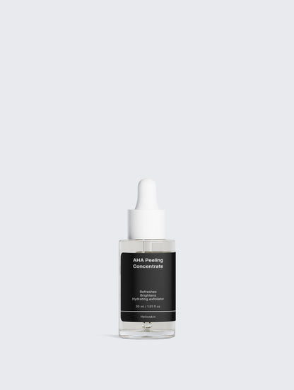 Skincare serum bottle with black label on a light gray background