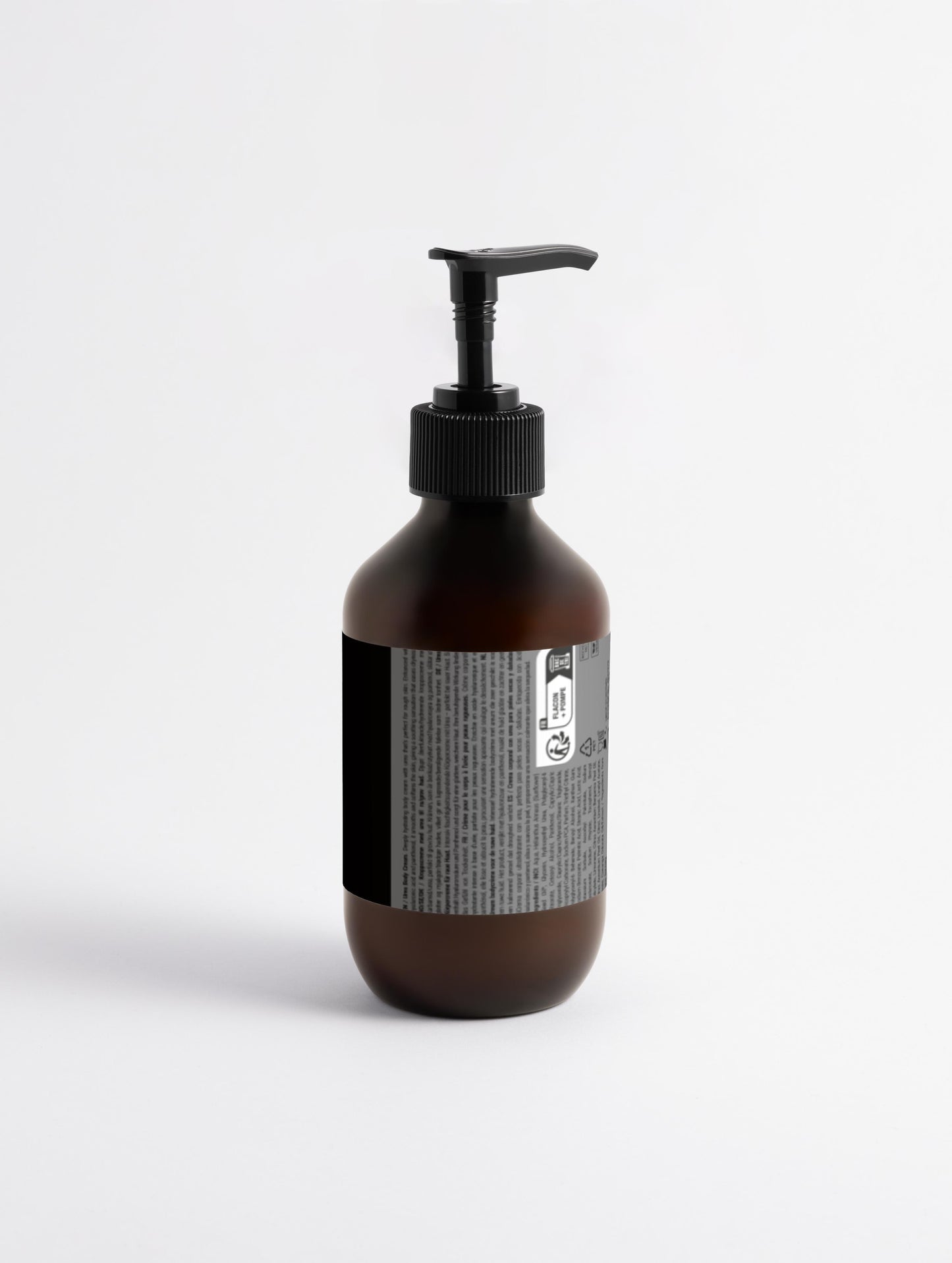 Brown bottle with pump and label on a white background